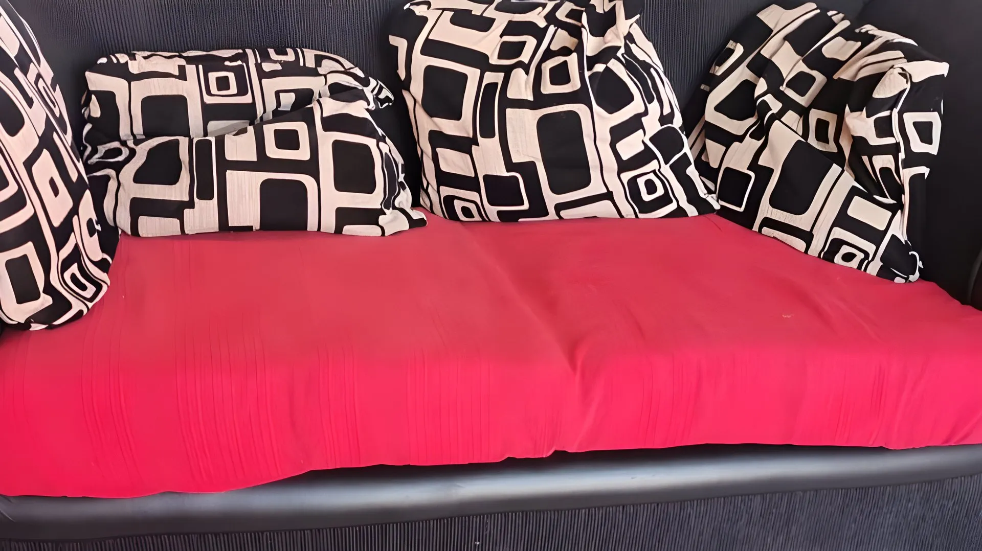 Before: Red-and-black chesterfield, re-covered in teal velvet
