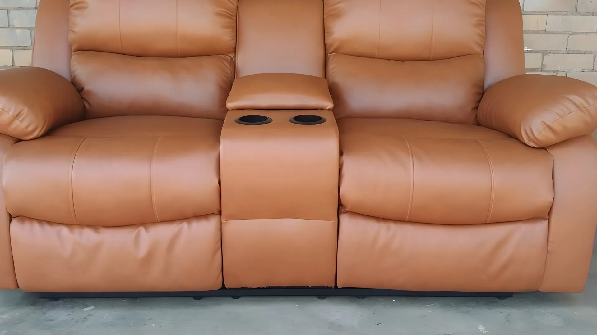 After: Peeling black recliner, redone in tan