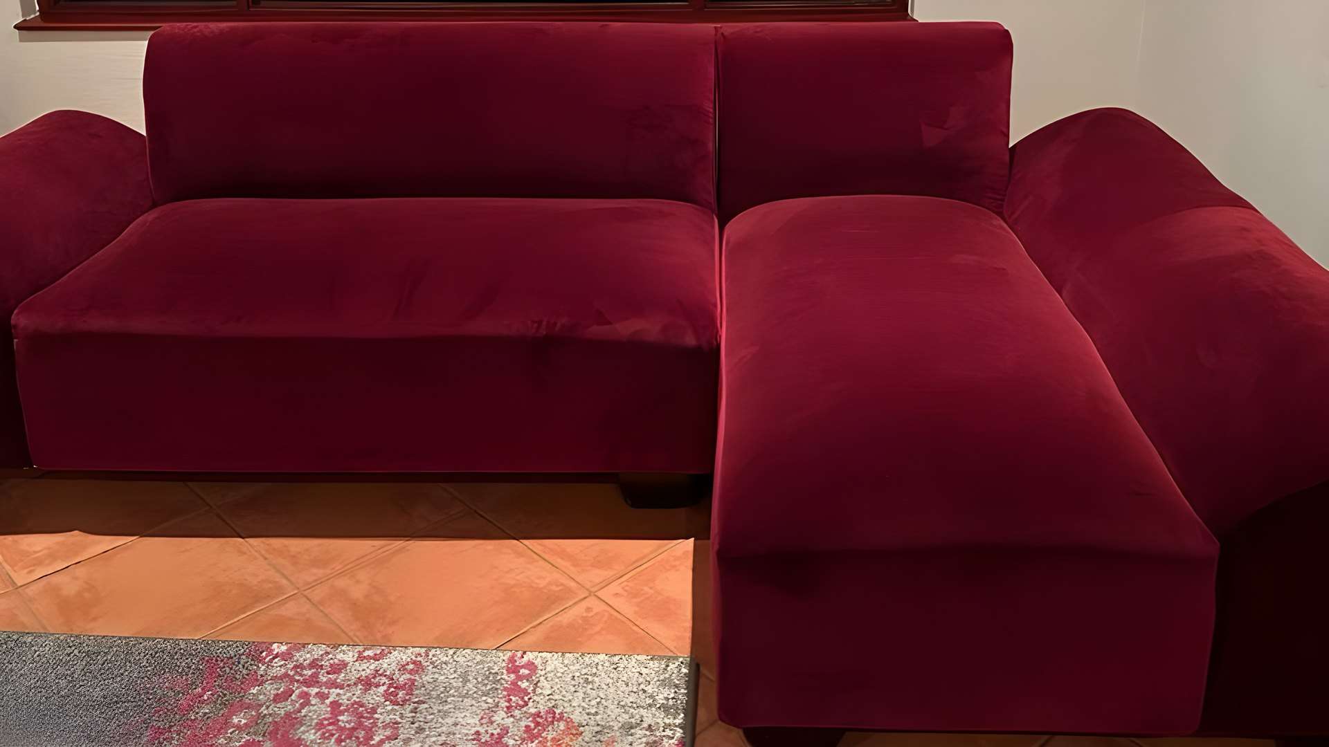 Corner couch re-covered in burgundy velvet