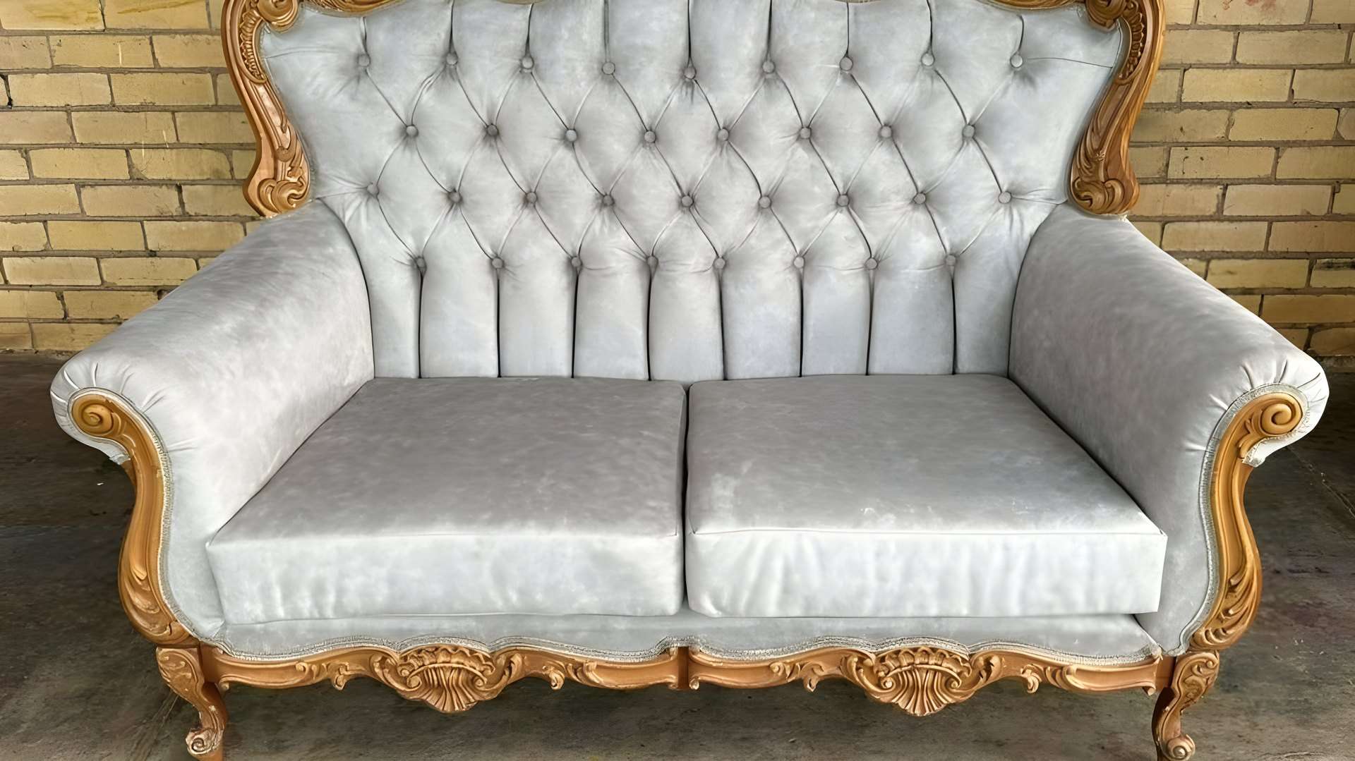 Carved settee re-covered in silver-grey