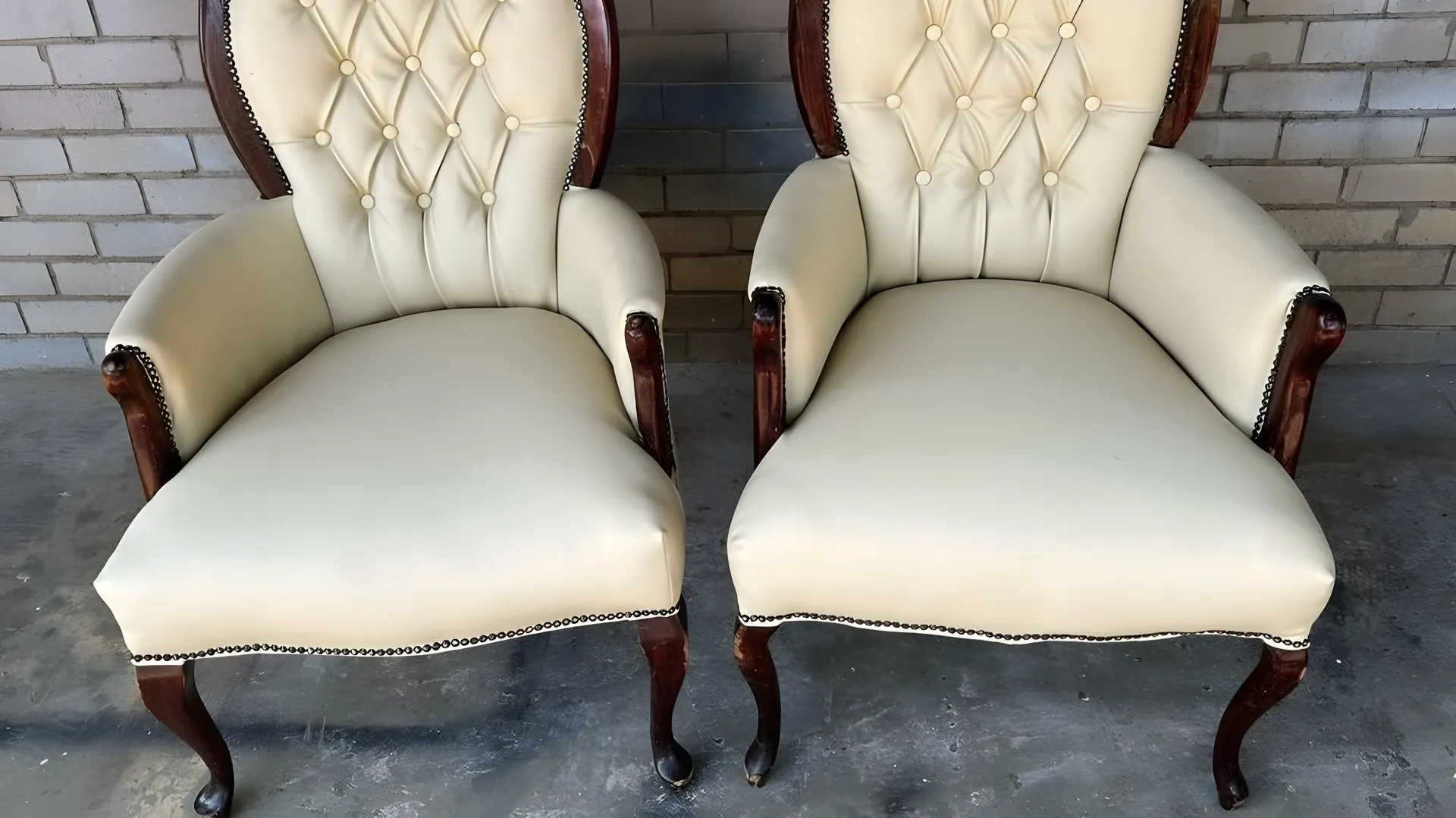 After: A pair of armchairs, re-covered in cream