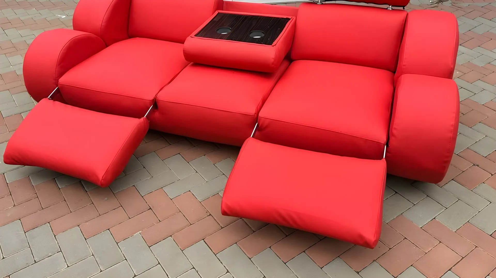 After: Peeling black leather couch, redone in red