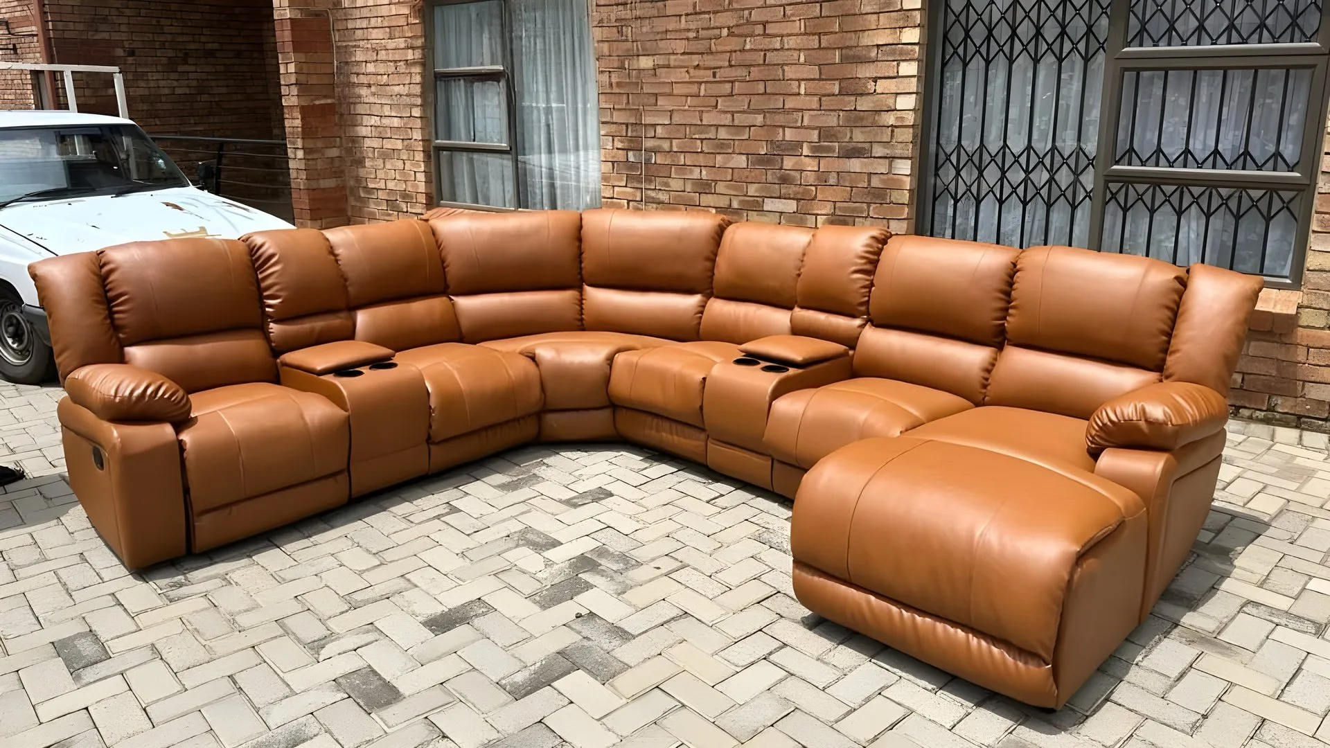 After: Black corner recliner suite, rebuilt in tan