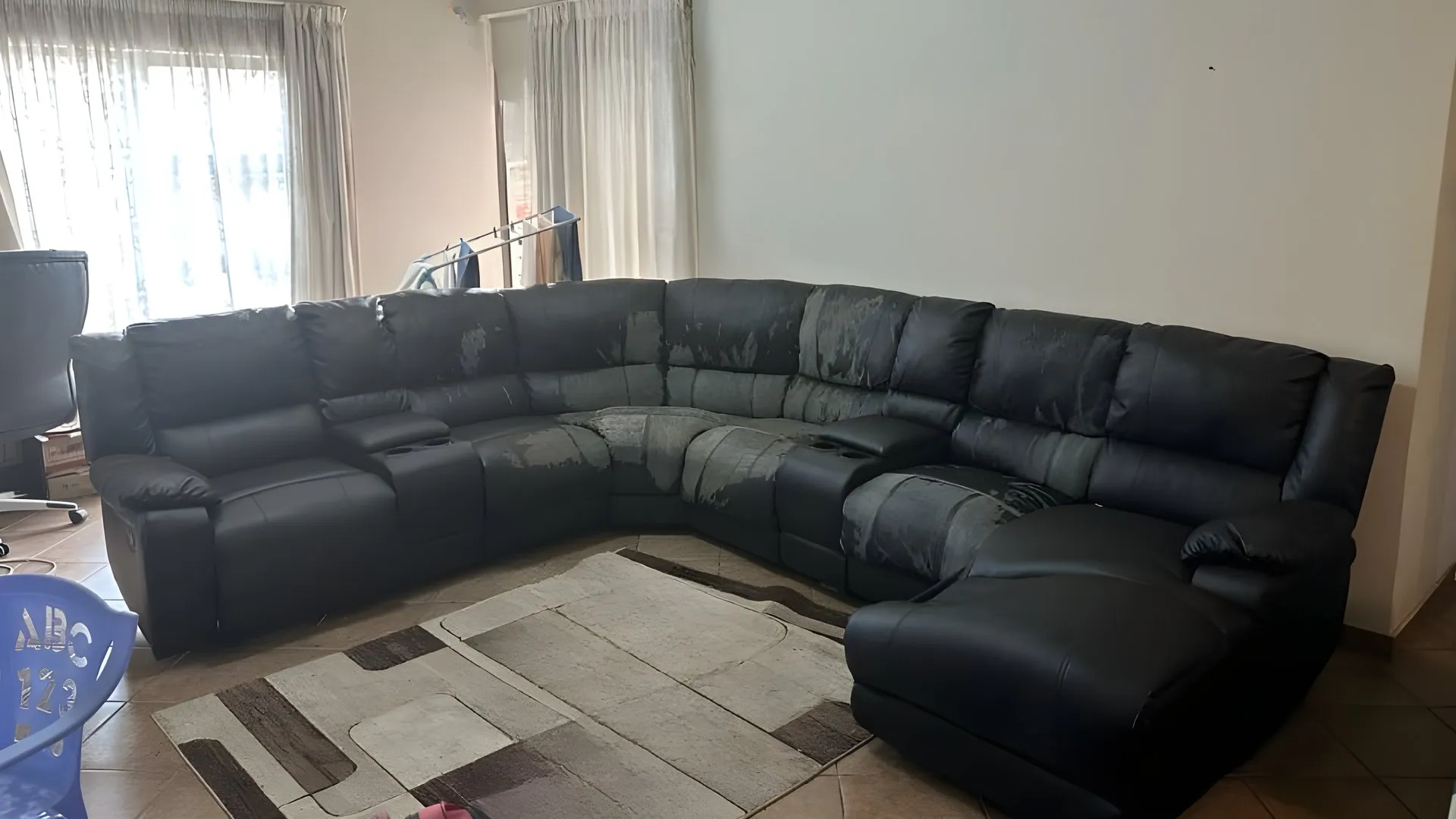Before: Black corner recliner suite, rebuilt in tan