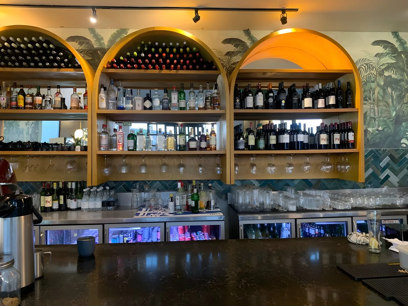 Arched wooden display shelving built for a restaurant